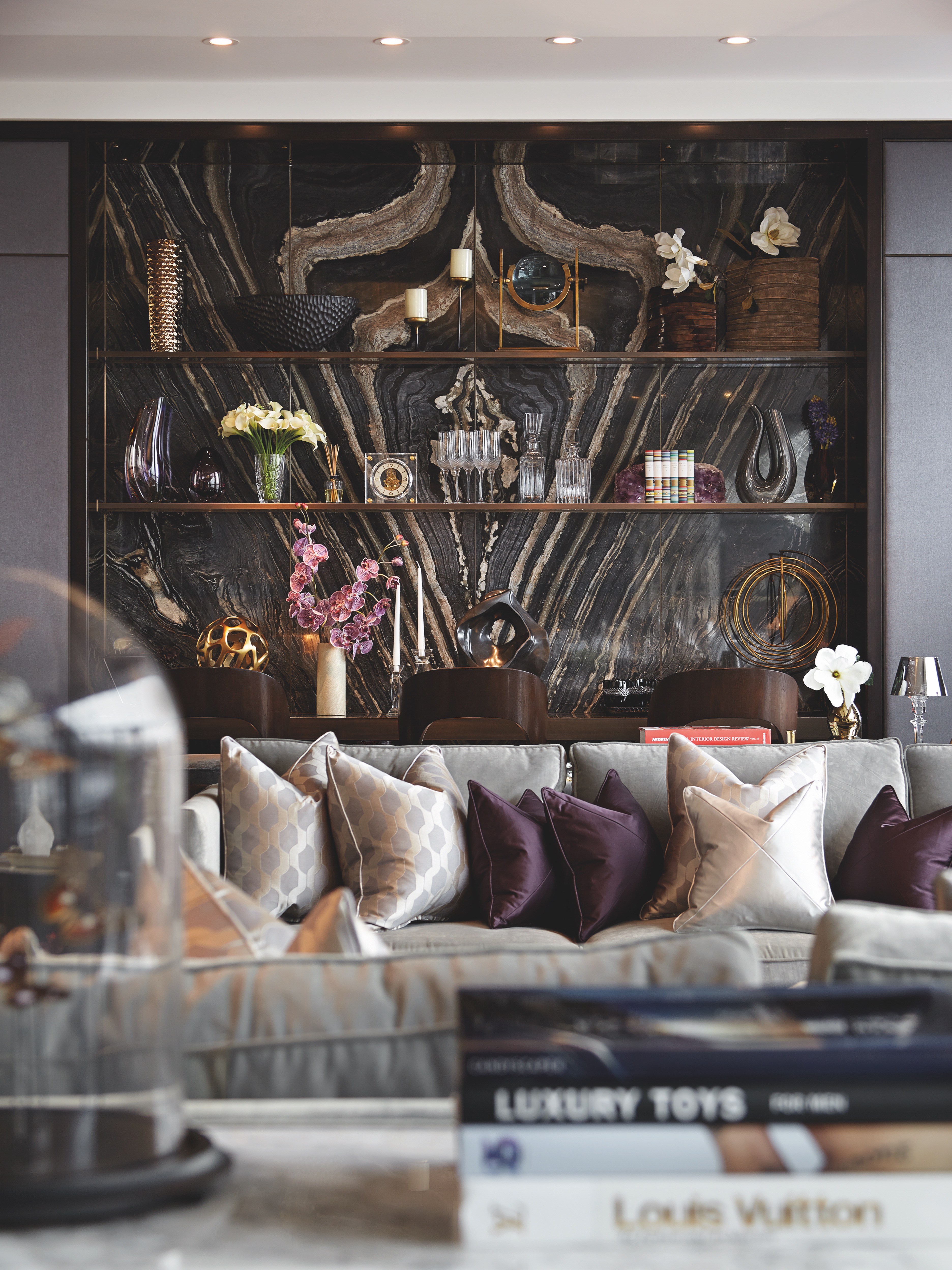 Client portfolio photograph: Plaza interior with a veined stone wall